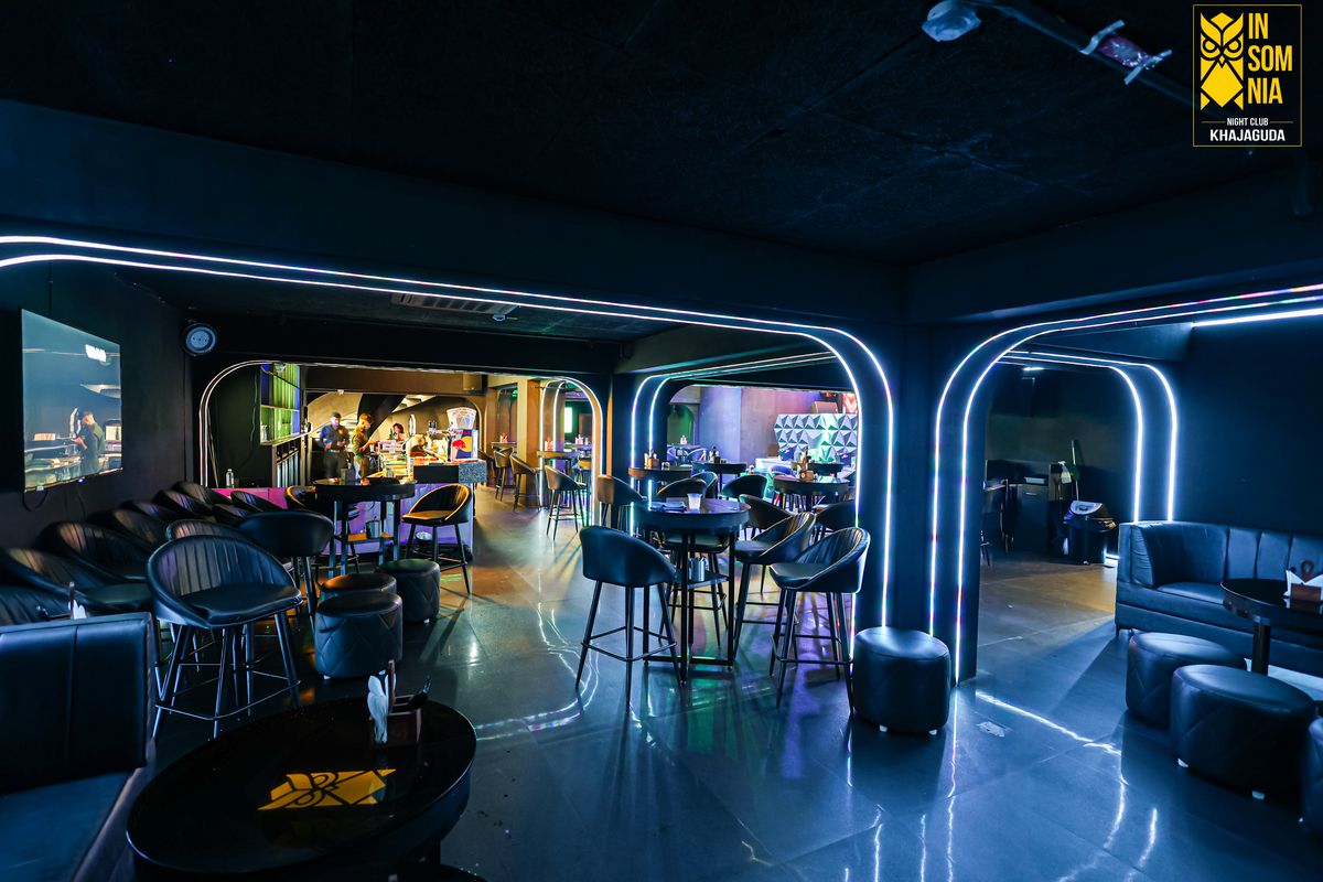 Main floor lounge under the neon arches — Insomnia Night Club, Khajaguda, Hyderabad
