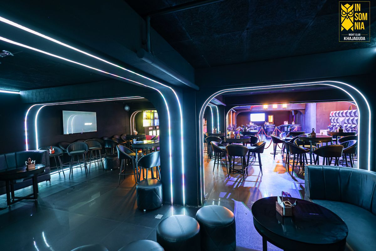 Neon arch seating and high tables — Insomnia Night Club, Khajaguda, Hyderabad