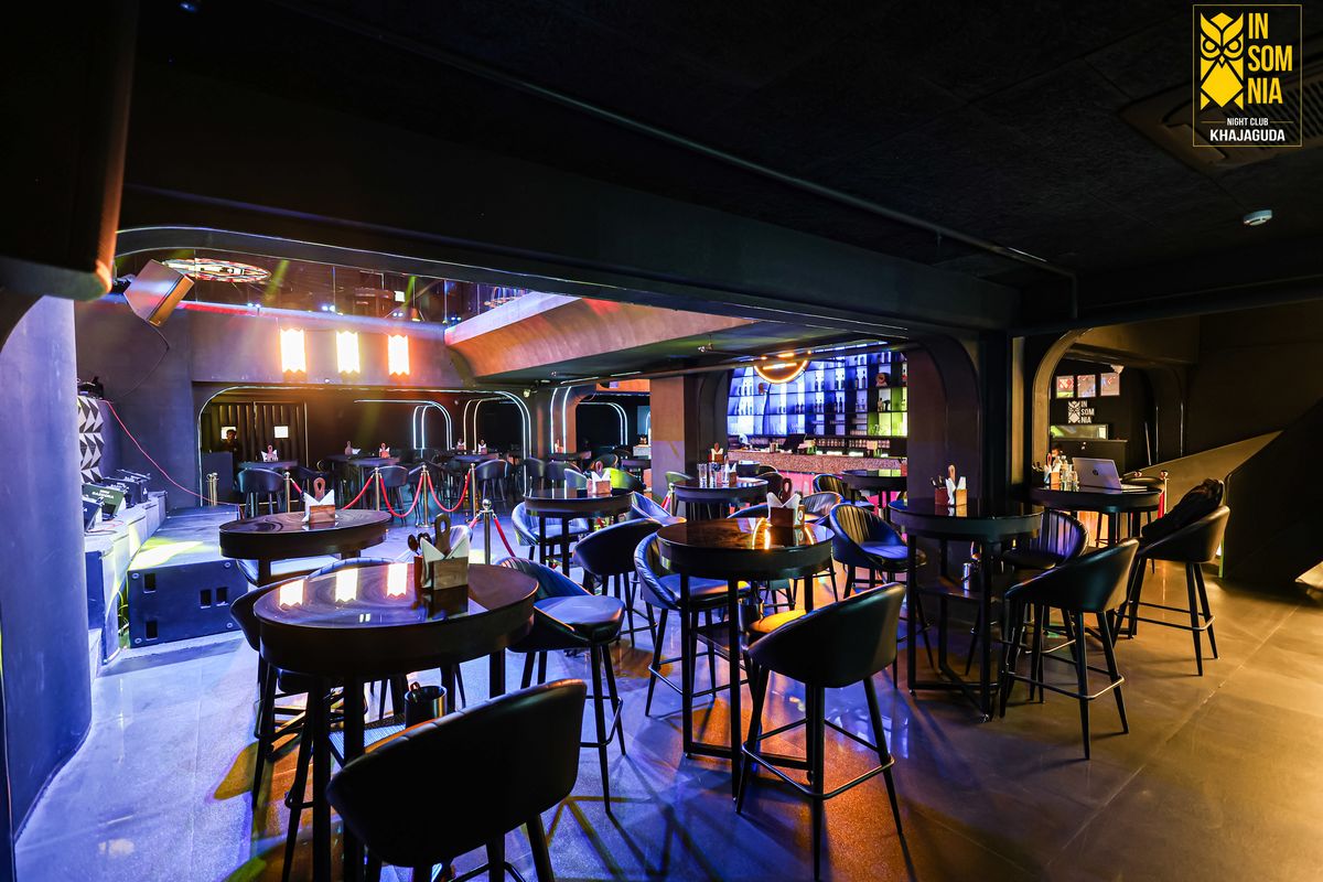 Reserved tables with the bar behind — Insomnia Night Club, Khajaguda, Hyderabad