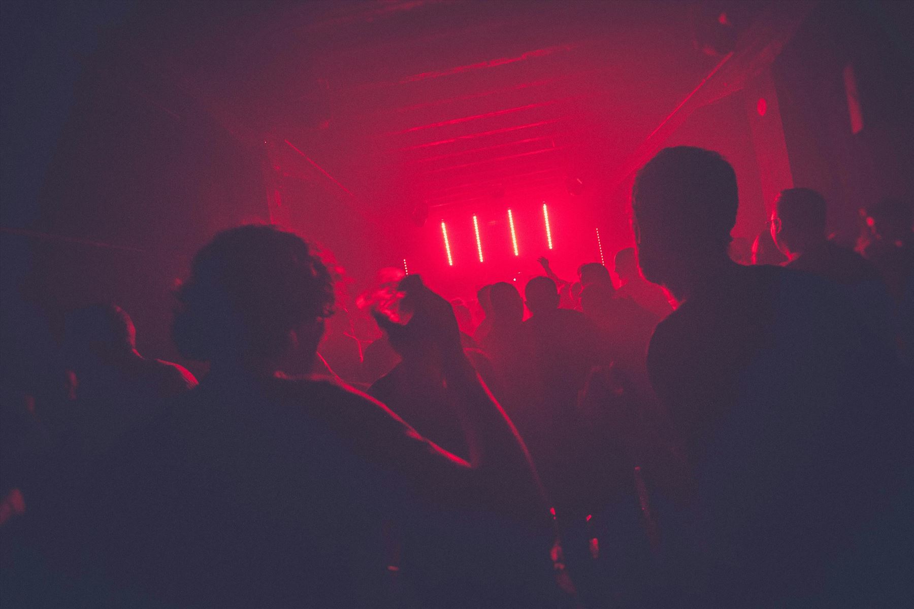 Nightclub laser lights and party crowd at Insomnia, Hyderabad