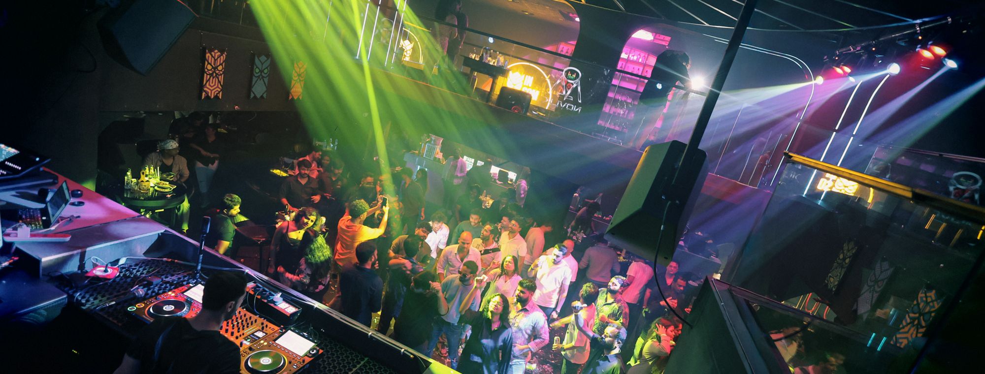 The dance floor packed under the laser rig — Insomnia Night Club, Khajaguda, Hyderabad